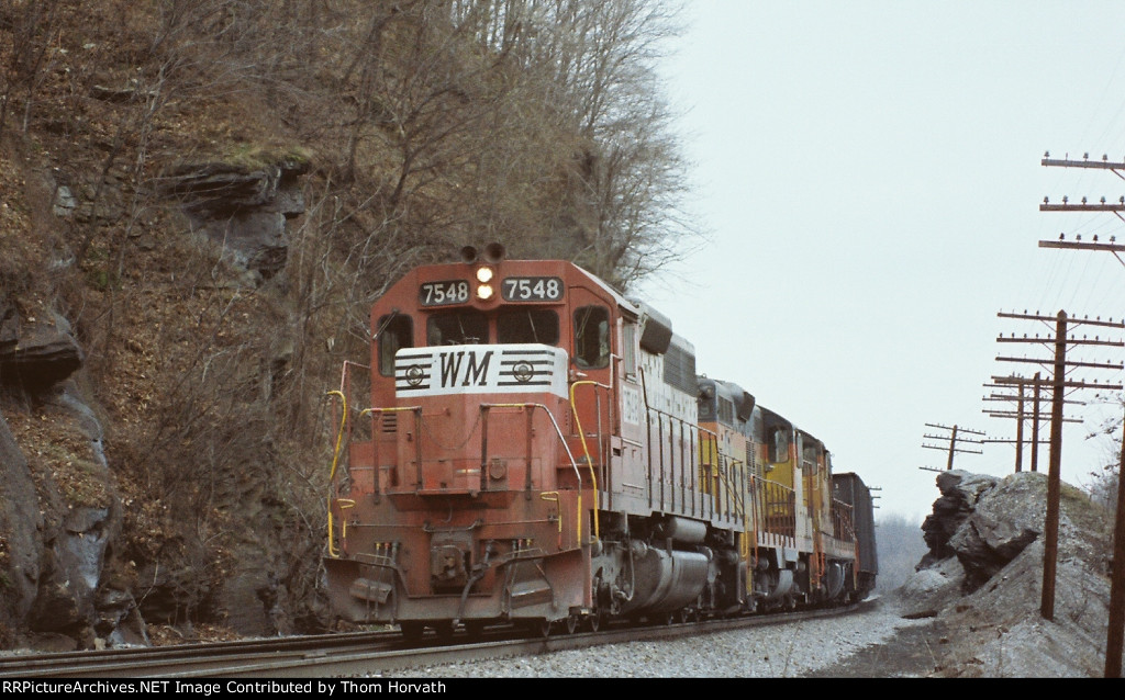 WM 7548 leads an EB coal train in an unknown dated scene